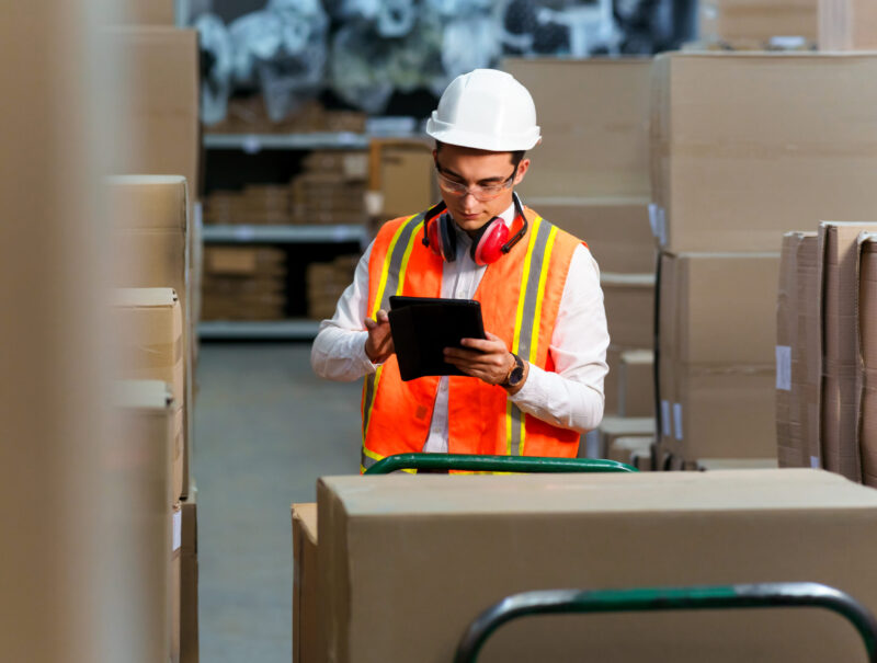 Employee of a logistics warehouse conducts an inventory of products